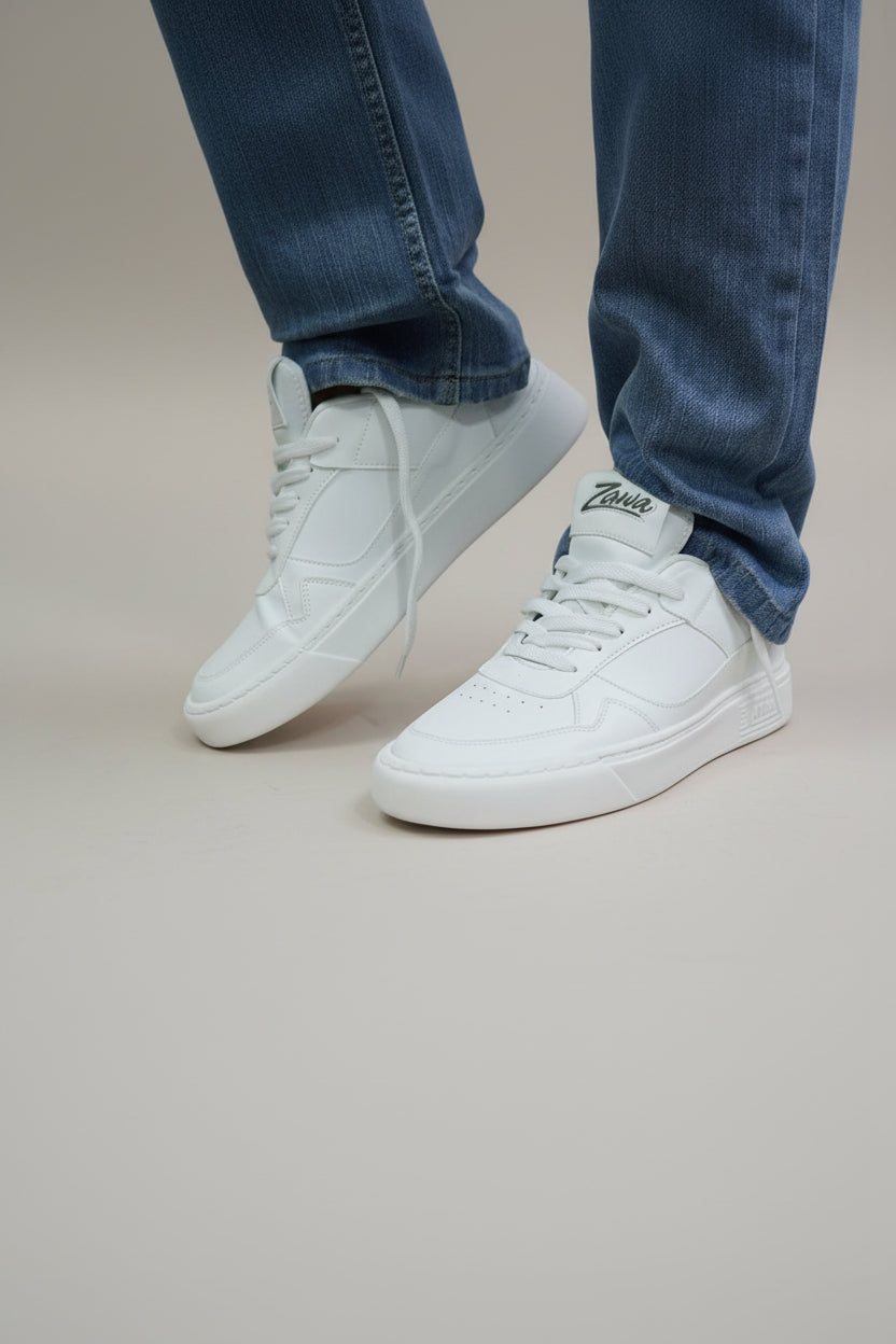 White ZAWA Aurion sneakers worn on blue jeans