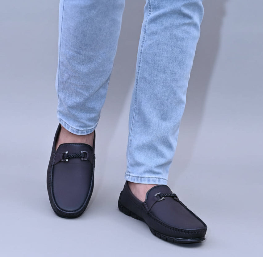 PERSON WEARING ZAWA LOAFERS WITH BLUE JEANS
