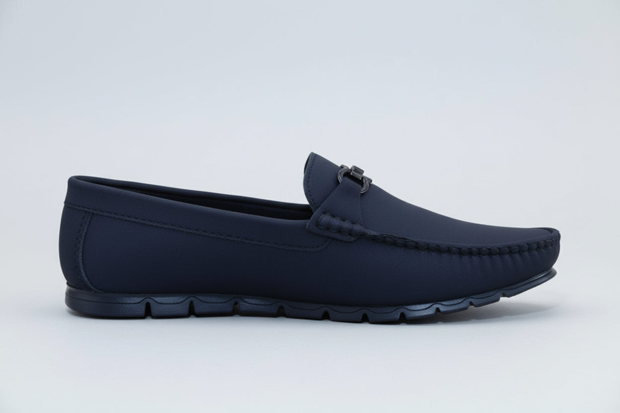 ZAWA Monarcha black loafer shoe on a light wooden surface