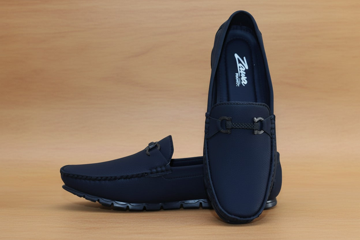 Pair of ZAWA Monarcha black loafers on a wooden surface