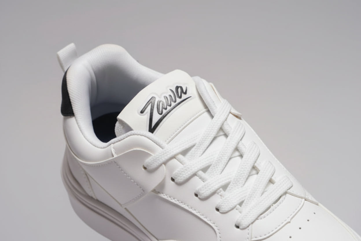 White sneaker with 'Zawa' branding on a beige background