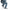Person wearing blue jeans and gray zawa sneakers sitting on a white background