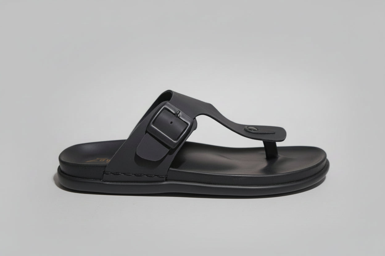 Black zawa rivano sandal with a strap on a plainbackground