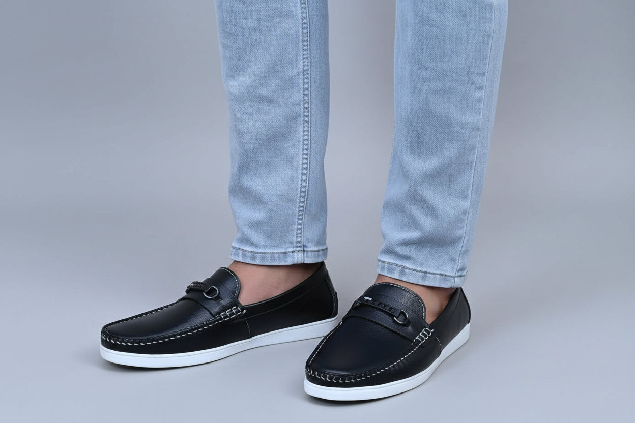 ZAWA Regent Black leather loafer shoes worn with light blue jeans on a plain surface