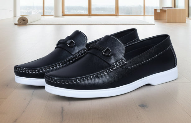 ZAWA Regent Black leather loafers with white soles on a marble surface
