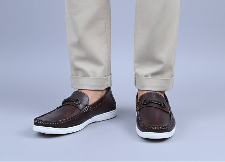 ZAWA Brown loafers worn with a light colour pant n a plain bg