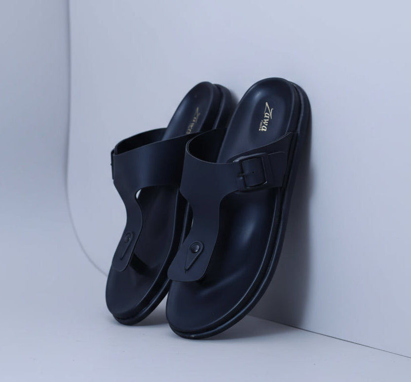 Pair of black rivano sandals with a visible Zawa brand logo on a light grey surface.