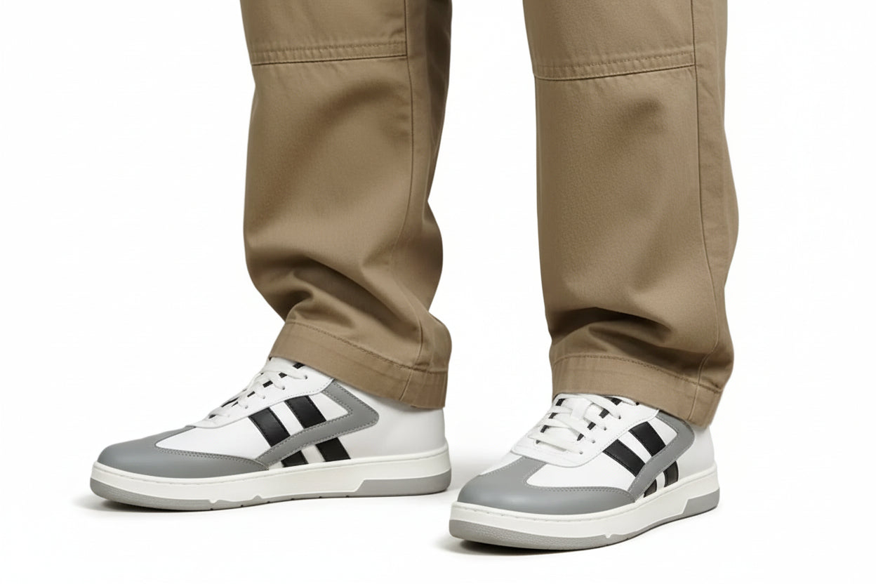 White and gray zawa daily wear  skydrift sneakers with cotton pants on a gray background