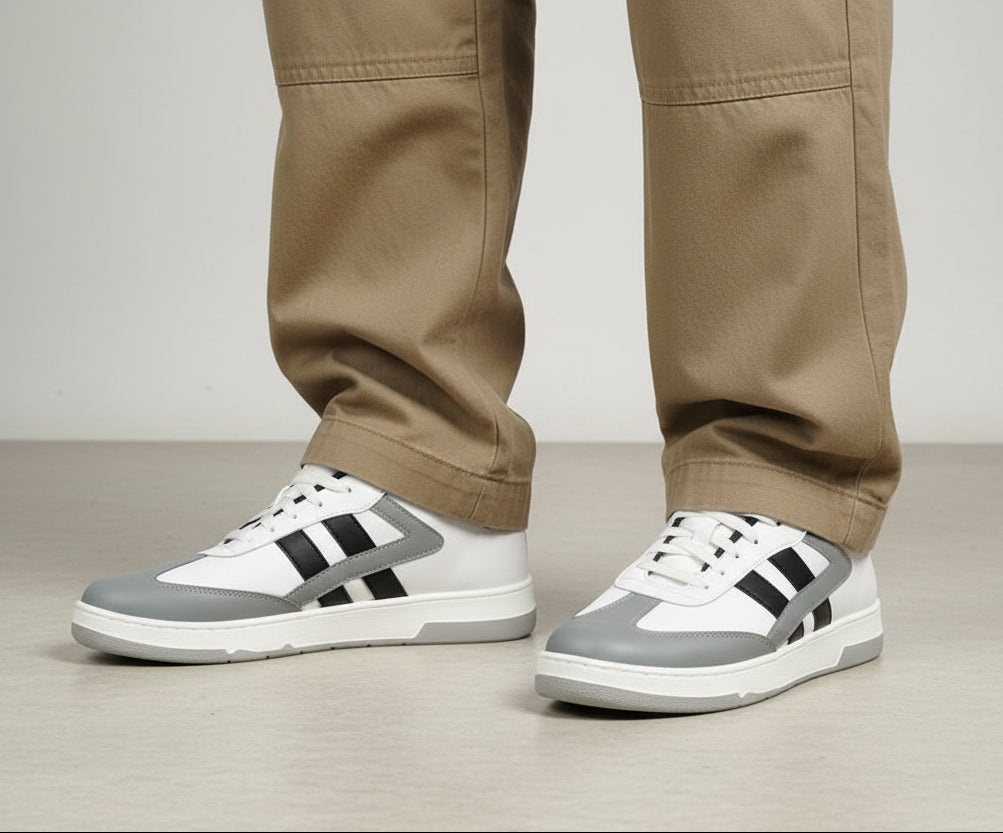 White and gray sneakers with cotton pants on a gray background