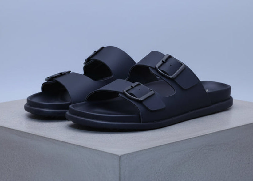 zawa vereno Black sandals with a strap on a plain background