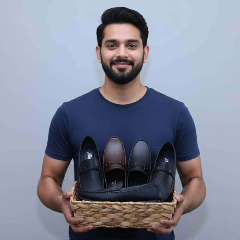 Man holding a basket of ZAWA loafer shoes against a plain background