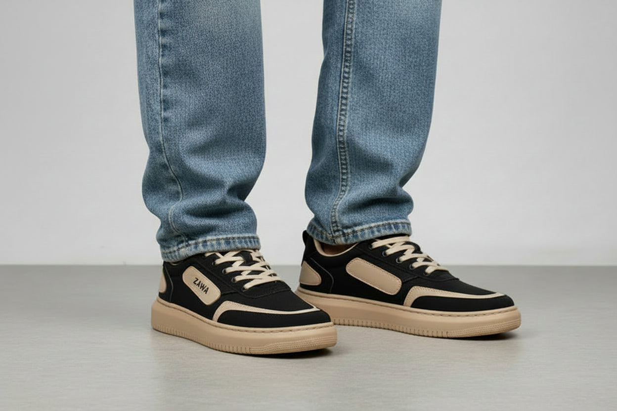 Black and beige sneakers with 'Zawa' branding on a light gray background