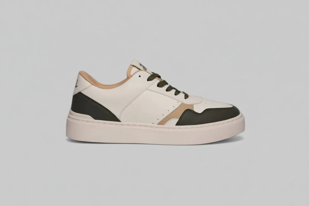 White zawa verdantis sneaker with black and brown accents on a gray background