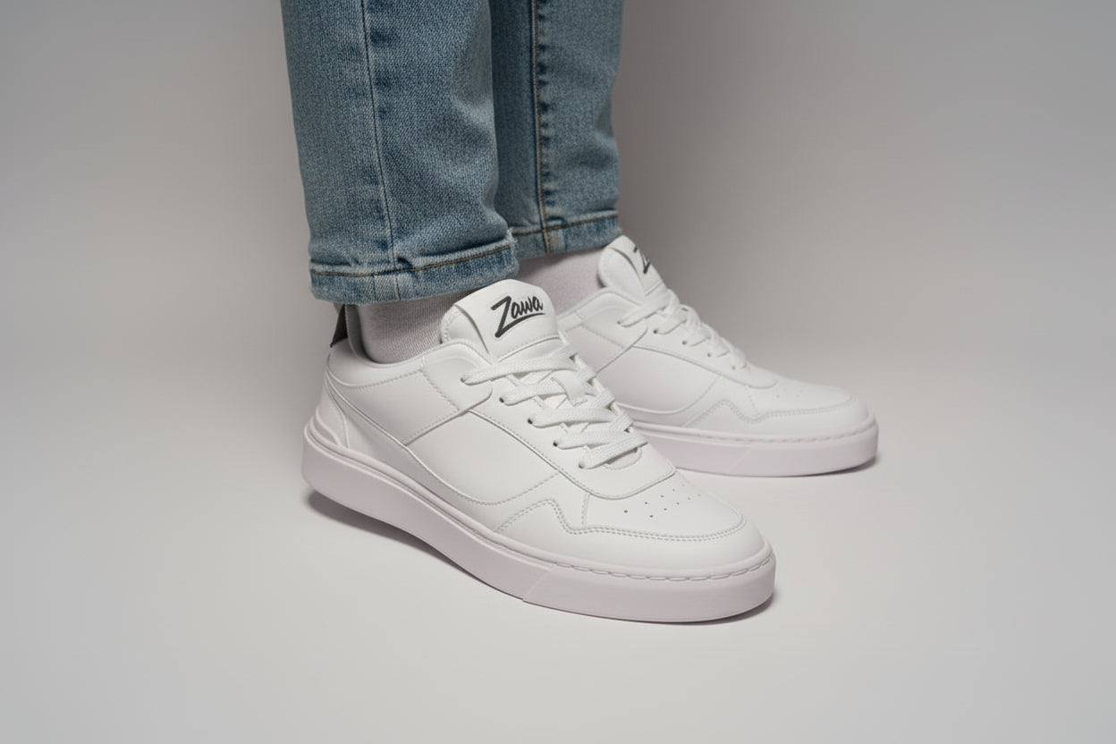 White sneaker with Zawa brand logo on a light gray background