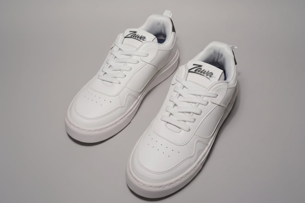 Pair of white zawa aurion sneakers with a Zawa brand logo on a gray background
