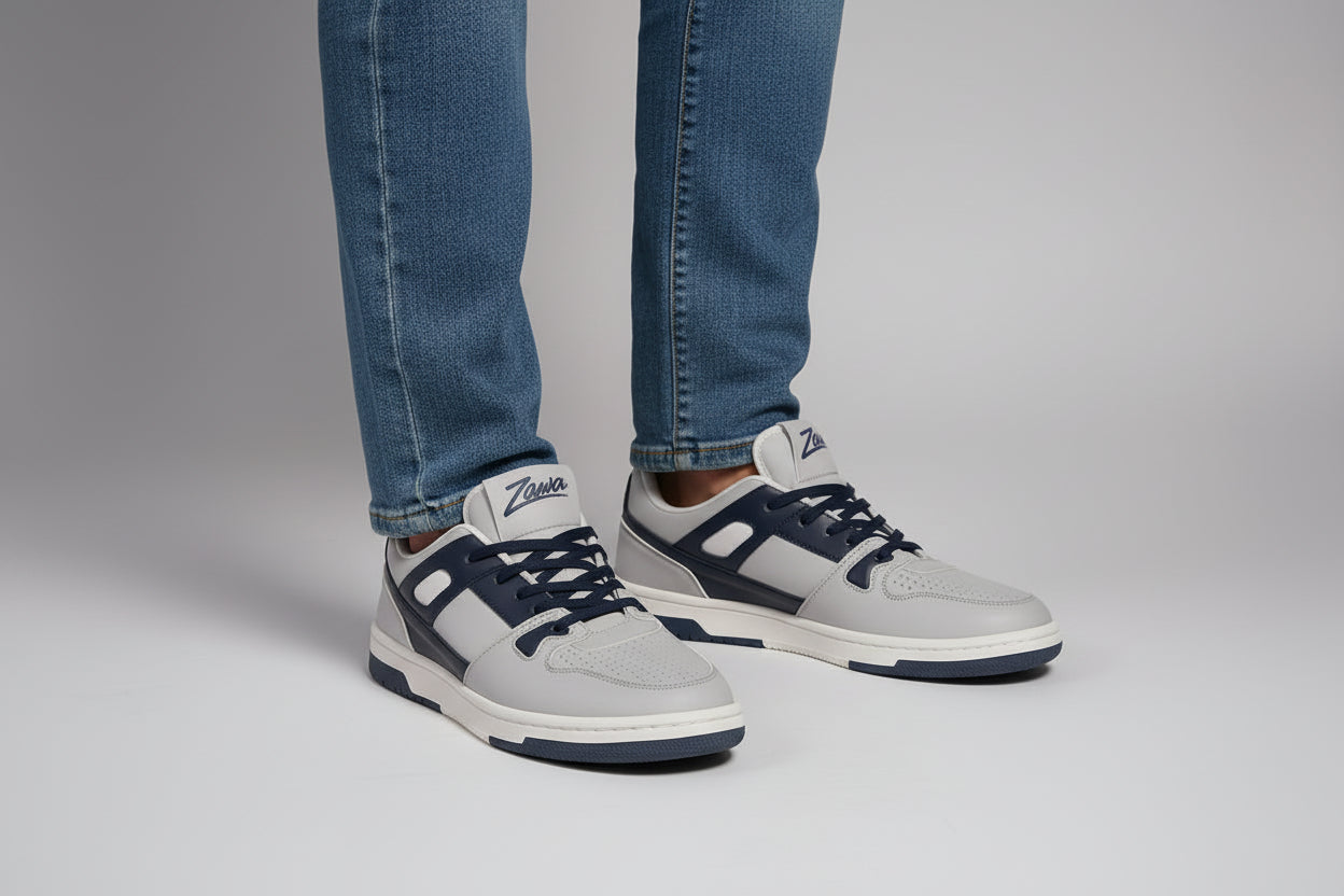 Pair of gray zawa coreflex sneakers with navy accents on a light gray background
