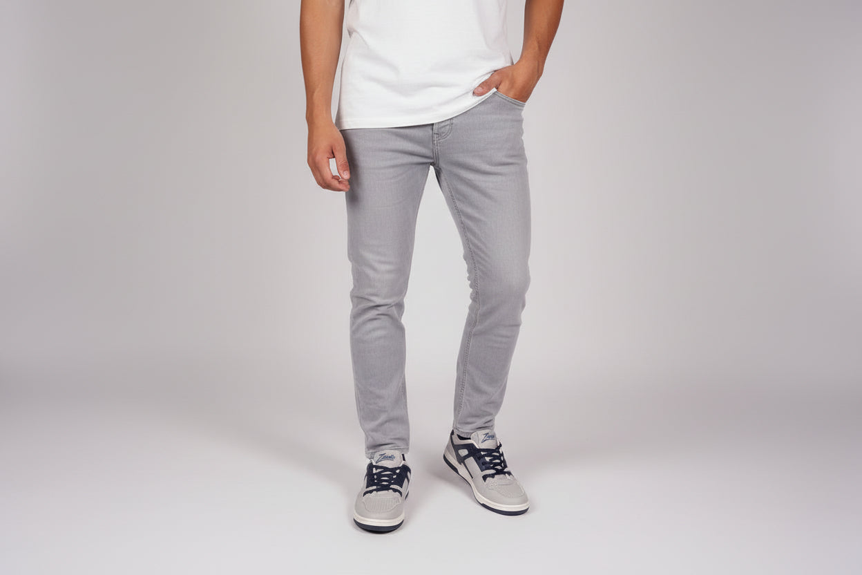 White zawa coreflex sneakers with blue laces worn on a blue jean