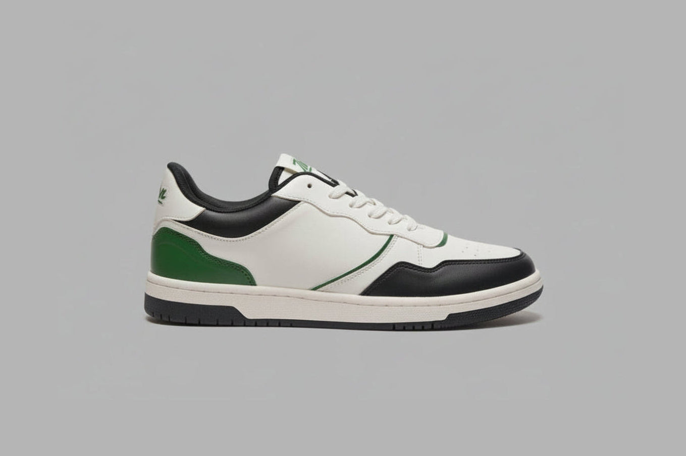 White zawa noctyra sneaker with black and green accents on a gray background