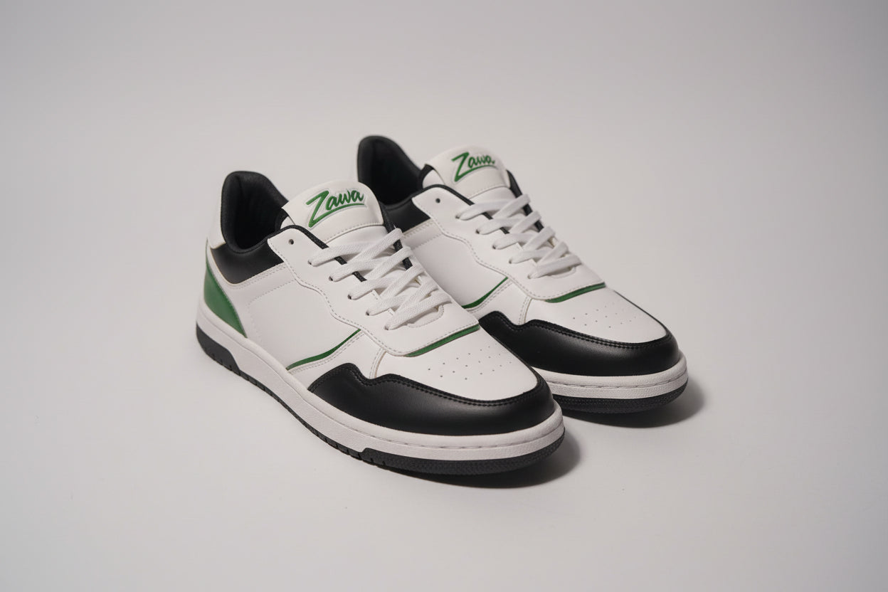 White and black zawa noctyra sneakers with green accents on a grey bakground