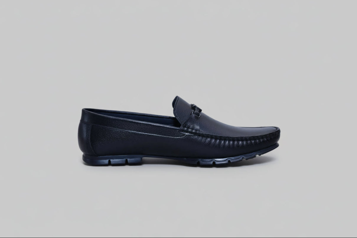 Black zawa valoris loafer shoe on a light gray background