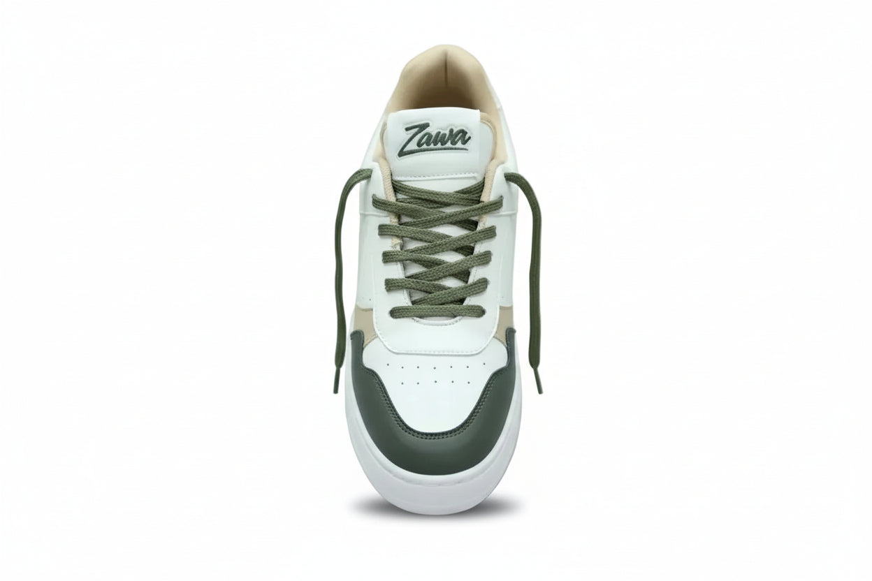 White zawa verdantis sneaker with green laces and black accents on a plain background