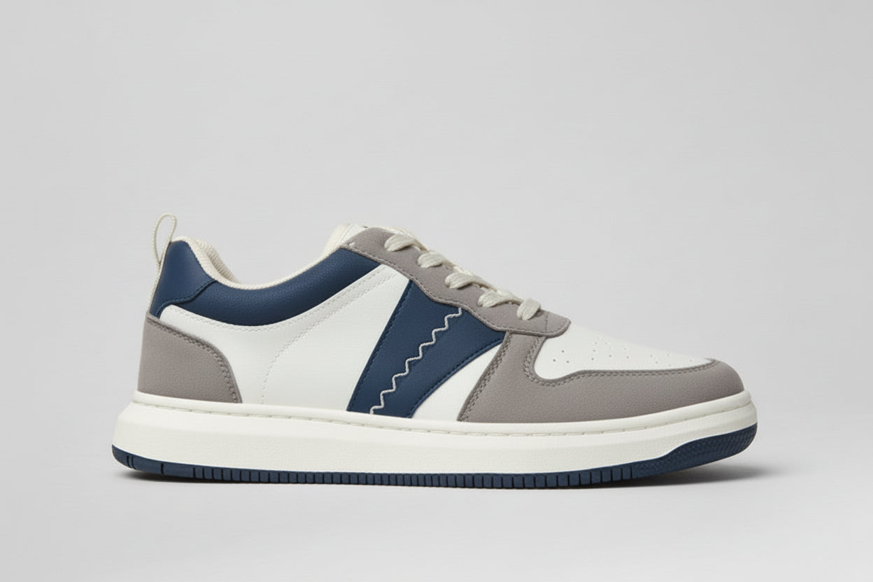 Gray and blue zawa shadow dune sneaker on a light gray background